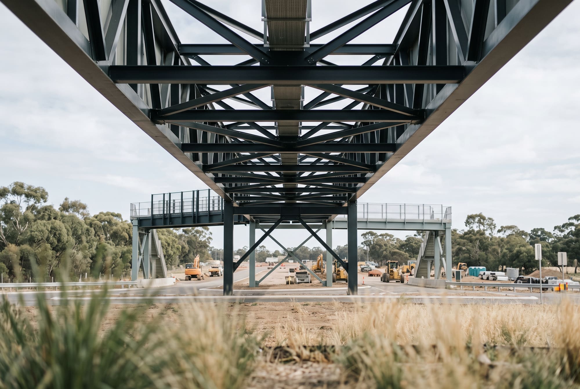 Steel truss footbridge over road works