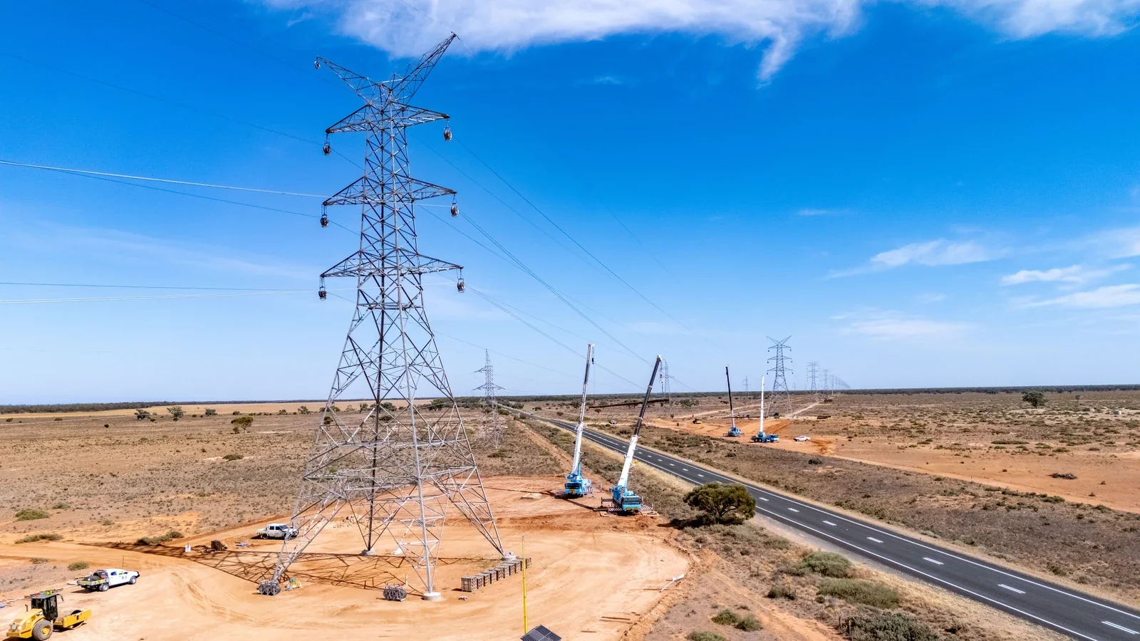 Transmission towers and cranes during Project EnergyConnect conductor stringing works at Balranald